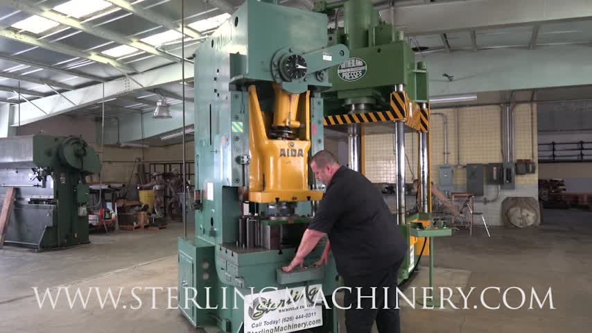 AIDA-100 TON X 6" USED AIDA GAP FRAME PUNCH PRESS, MDL. PC-10 II, AIR CLUTCH AND BRAKE, T-SLOTTED RAM, ONE SHOT LUBE SYSTEM, DUAL PALM BUTTON CONTROL, FOOT PEDAL, T-SLOTTED BOLSTER, #A6165-01